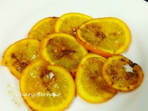 Lomo de merluza, con calabacín, ajo negro y naranja