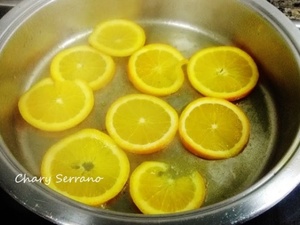 Lomo de merluza, con calabacín, ajo negro y naranja