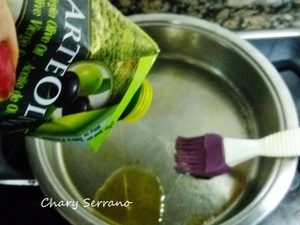 Lomo de merluza, con calabacín, ajo negro y naranja