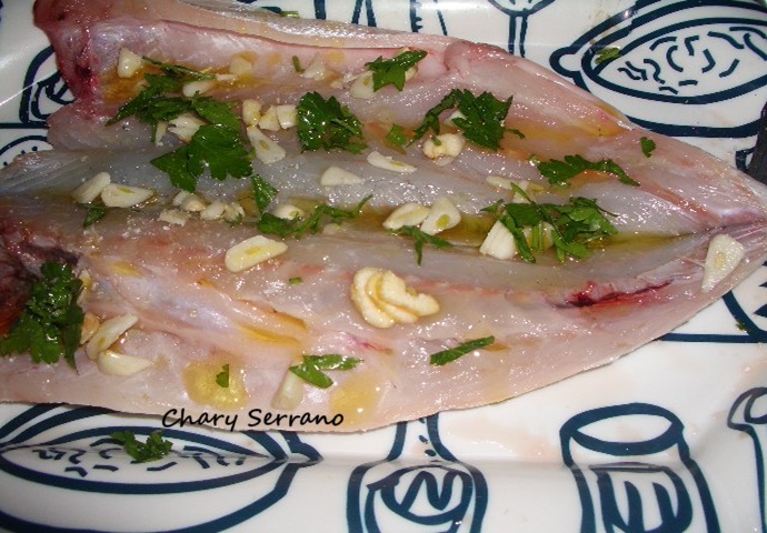 Lubina a la espalda con patatas especiadas